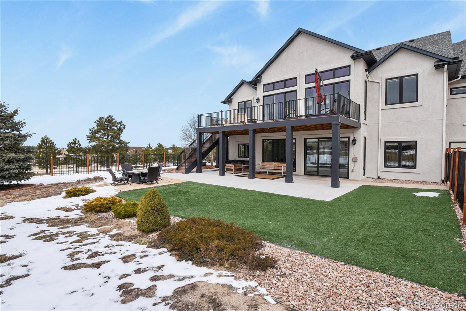 5220 Roundup Ridge Road Colorado Springs, CO 80908 - Photo 41 of 50 a view of a house with a yard patio and swimming pool