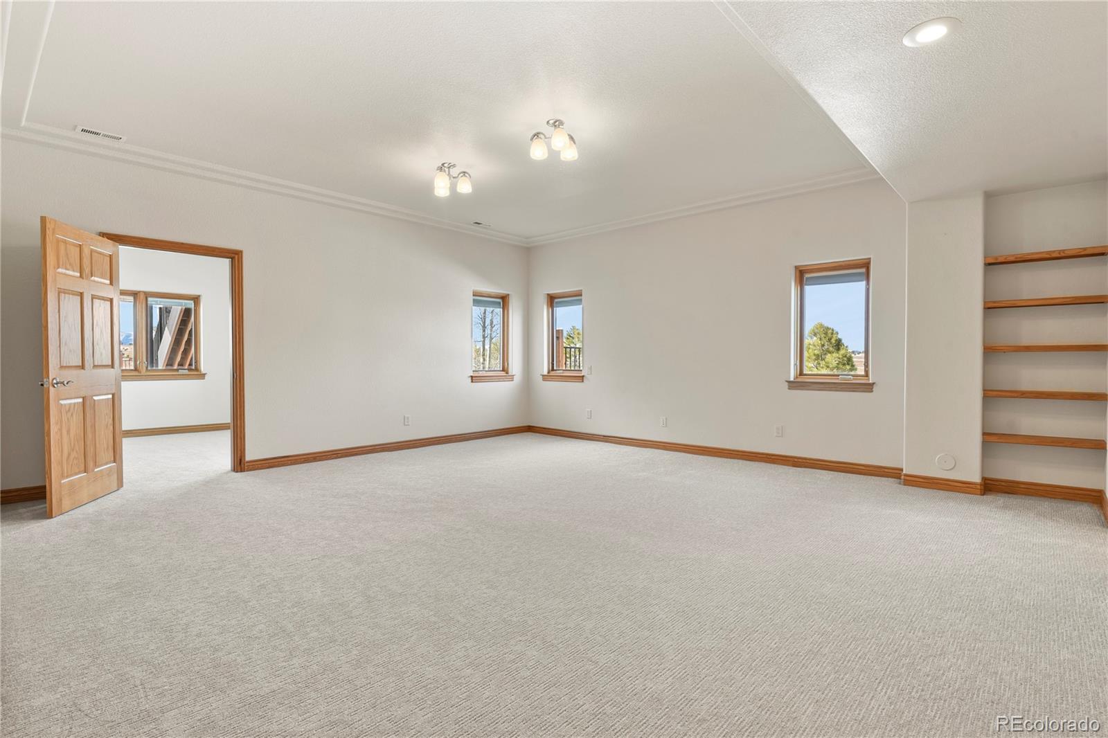 5220 Roundup Ridge Road Colorado Springs, CO 80908 - Photo 46 of 50 a view of an empty room with a window