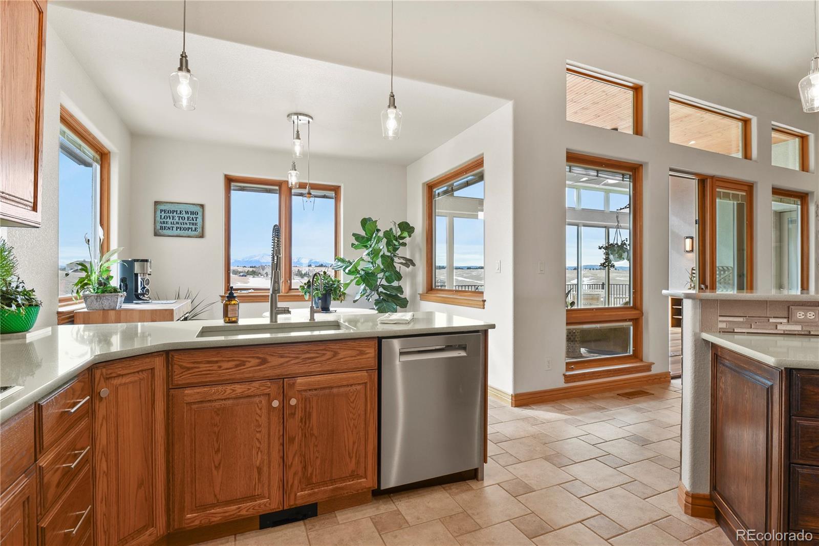 5220 Roundup Ridge Road Colorado Springs, CO 80908 - Photo 10 of 50 a kitchen with cabinets and window