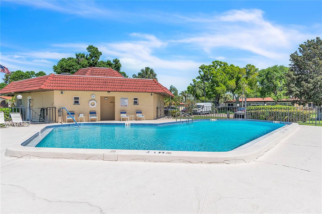 12200 Vonn Road, Unit 2206 Largo, FL 33774 - Photo 55 of 60 a front view of a house with a yard