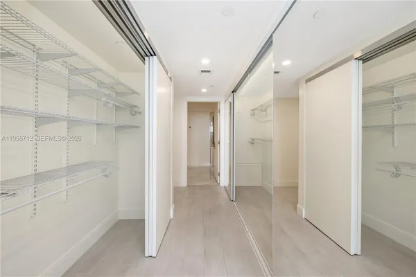 a view of a hallway with white walls