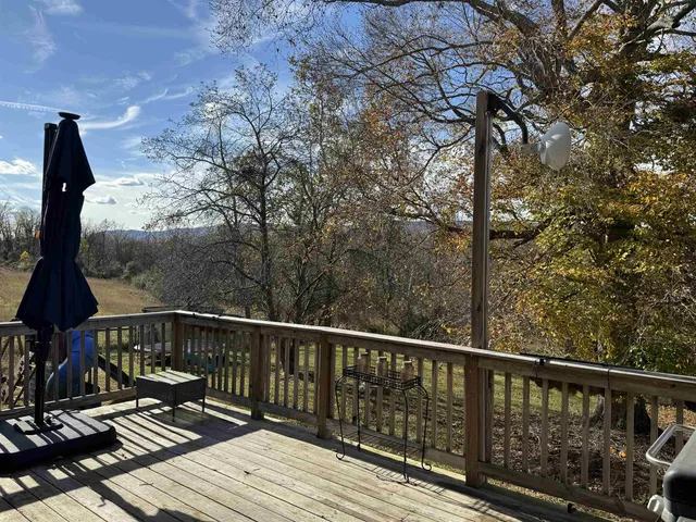 a view of balcony with wooden floor