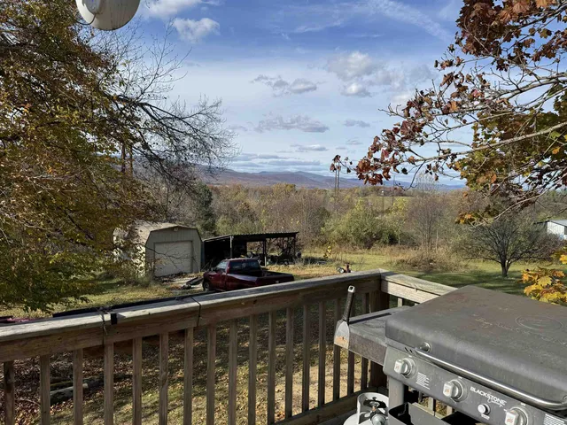 a view of a balcony with chairs