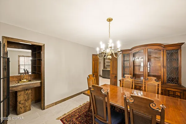 a view of a dining room with furniture and a livingroom