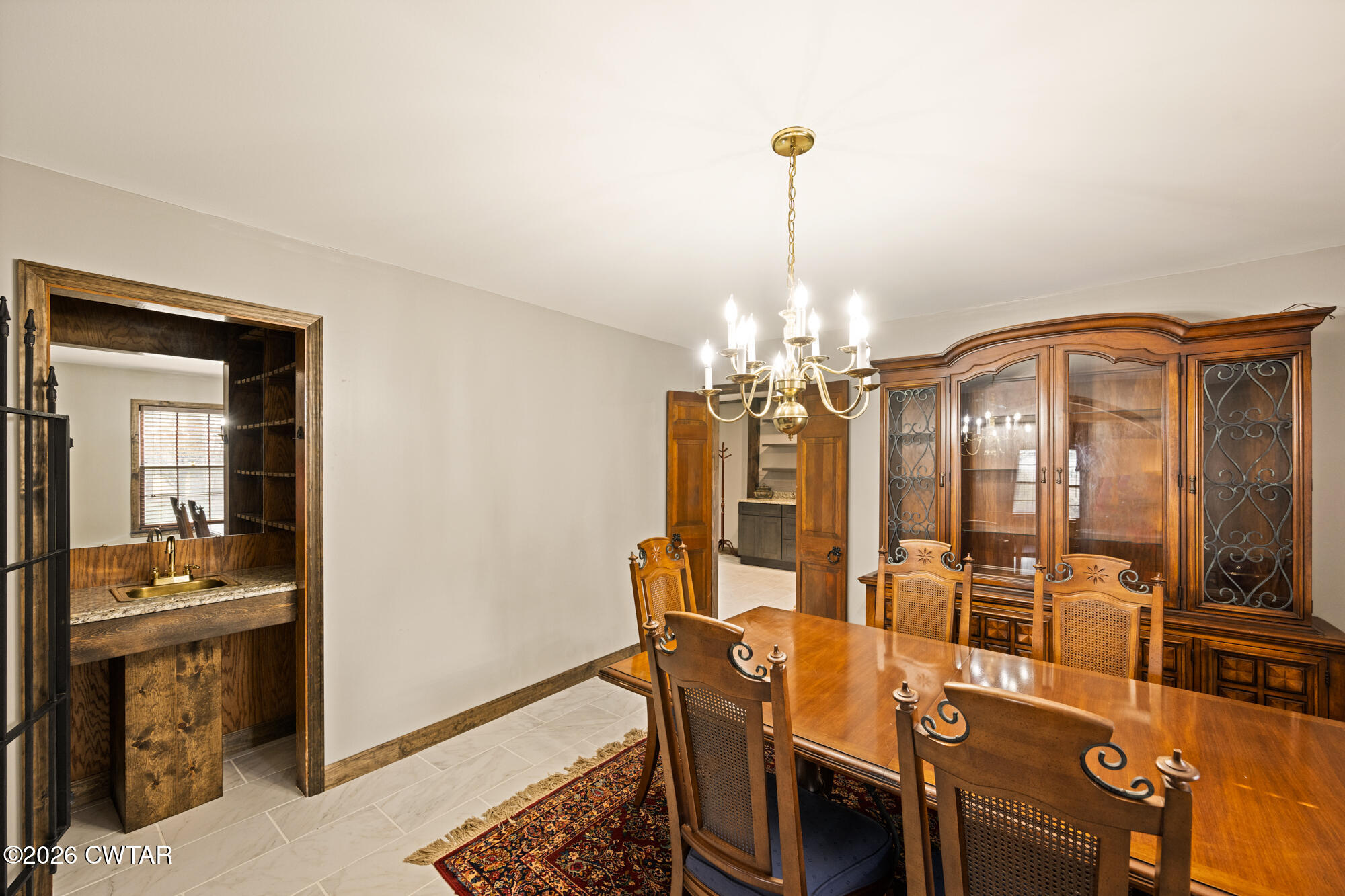 260 Myracle Town Road Parsons, TN 38363 - Photo 19 of 36 a view of a dining room with furniture and chandelier