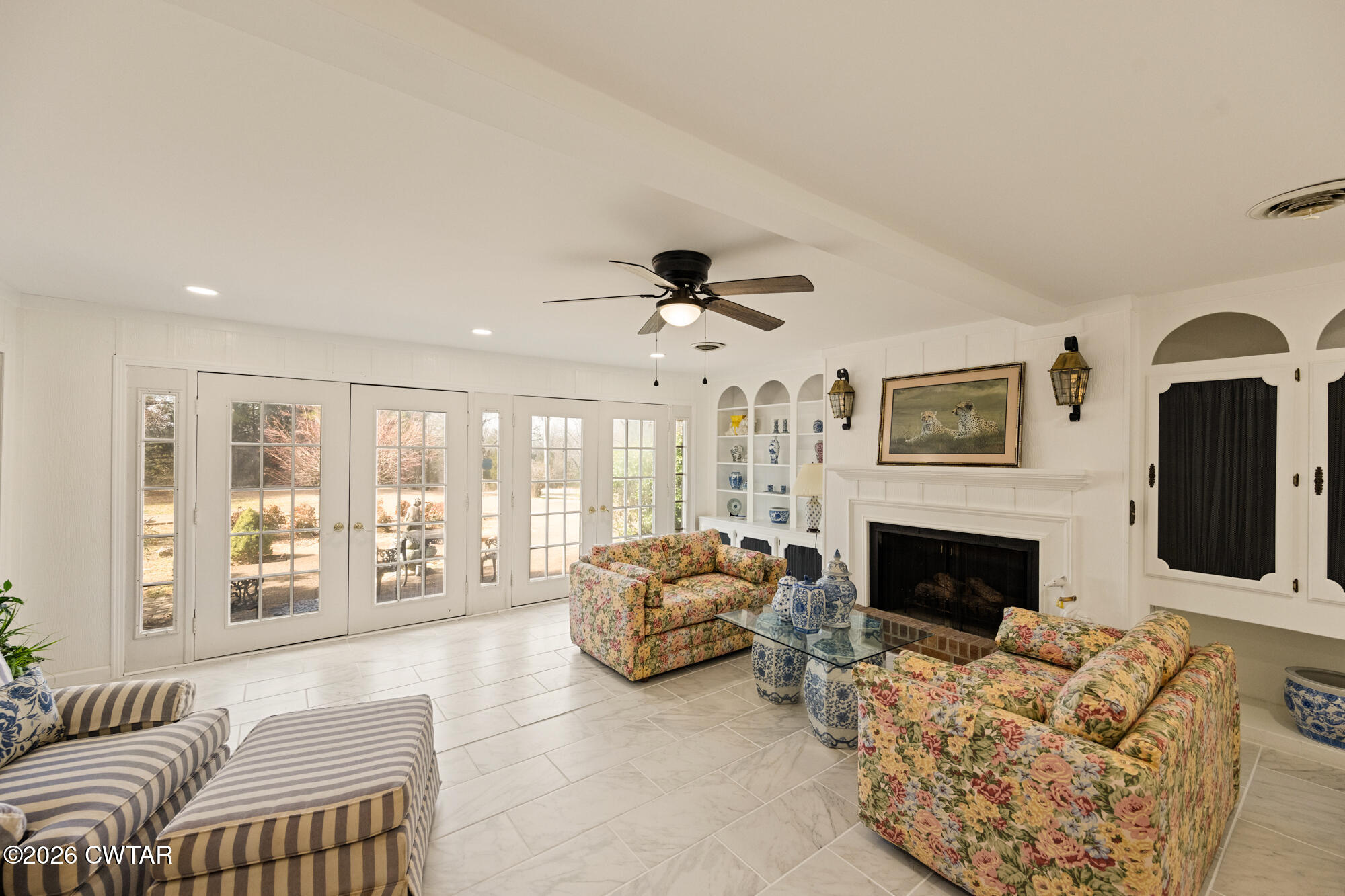 260 Myracle Town Road Parsons, TN 38363 - Photo 26 of 36 a living room with furniture fireplace and flat screen tv