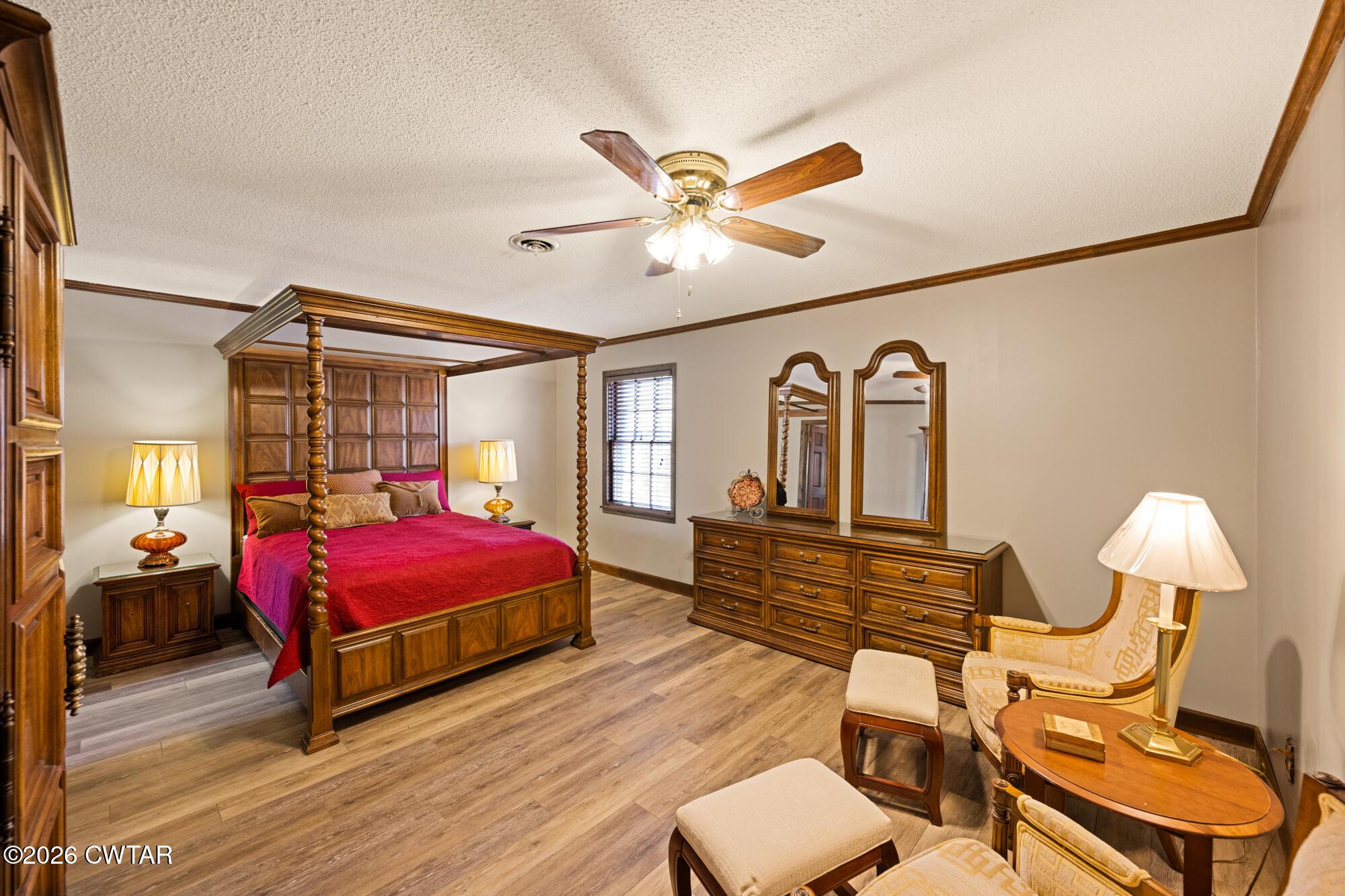 260 Myracle Town Road Parsons, TN 38363 - Photo 27 of 36 a bedroom with furniture and wooden floor