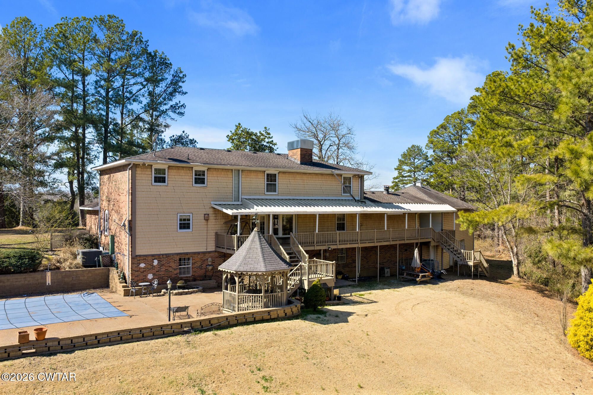 260 Myracle Town Road Parsons, TN 38363 - Photo 3 of 36 a front view of a house with a yard