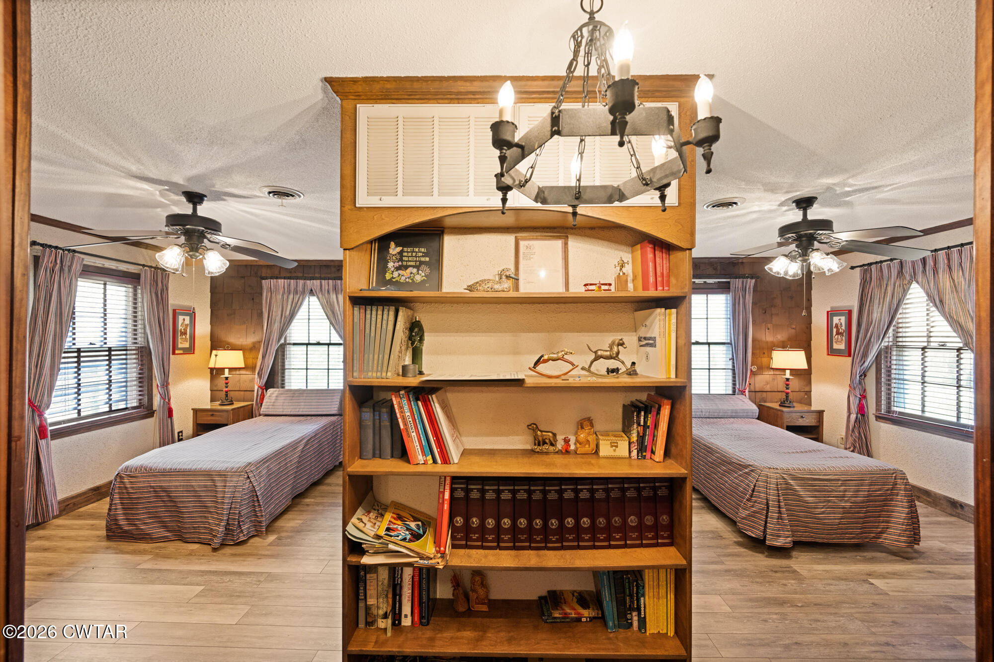 260 Myracle Town Road Parsons, TN 38363 - Photo 32 of 36 a living room with furniture a flat screen tv and a floor to ceiling window