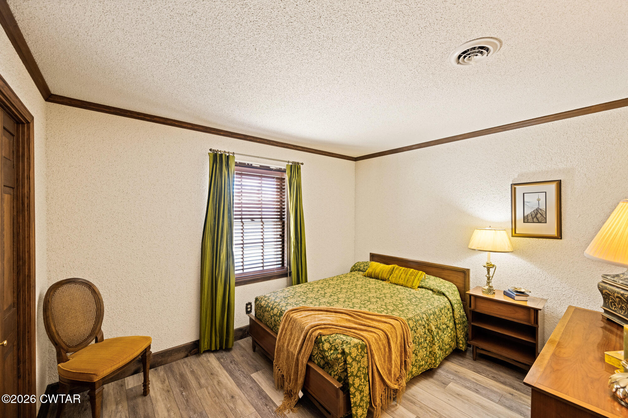 260 Myracle Town Road Parsons, TN 38363 - Photo 34 of 41 a bedroom with a bed chair and a window
