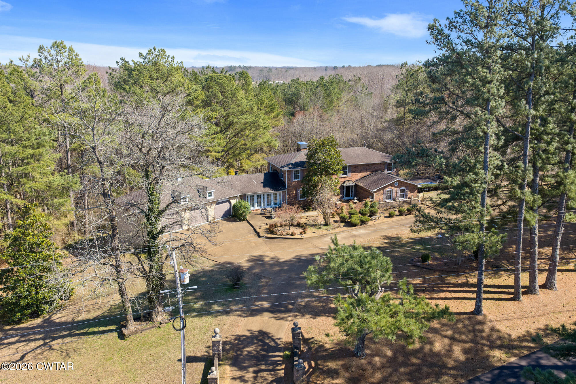 260 Myracle Town Road Parsons, TN 38363 - Photo 5 of 36 a view of a fire pit with flower garden
