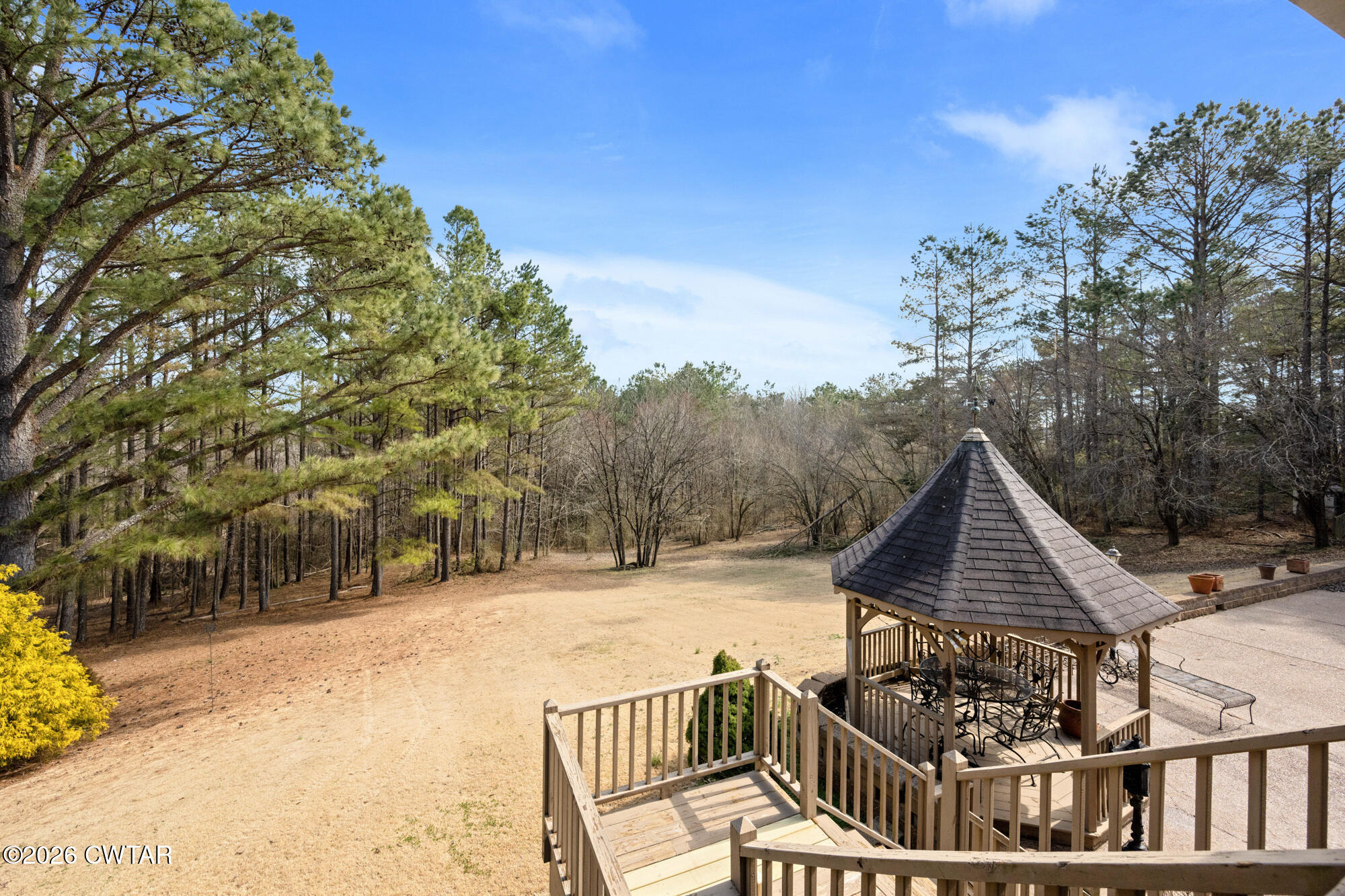 260 Myracle Town Road Parsons, TN 38363 - Photo 10 of 36 a view of a roof deck with couches and wooden fence