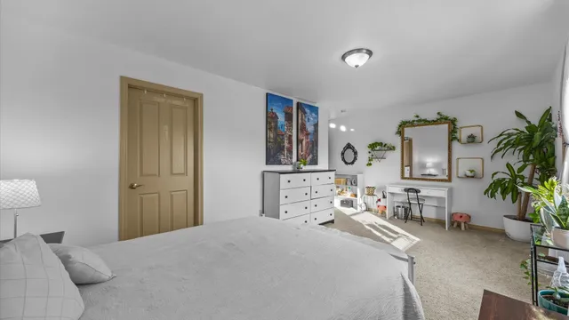 a bedroom with a bed and a couch