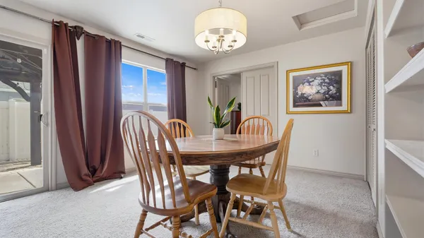 a bedroom with a bed and a lamp on table