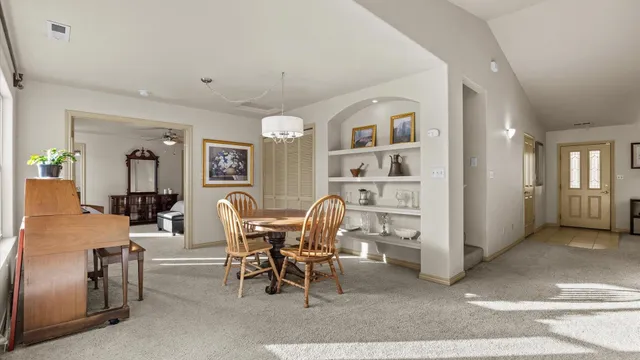 a view of a livingroom with furniture and window