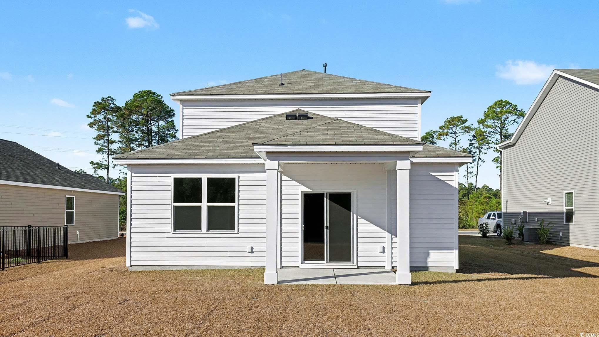 117 Homestead Way Myrtle Beach, SC 29588 - Photo 2 of 23 Rear view of property featuring a shingled roof and a patio