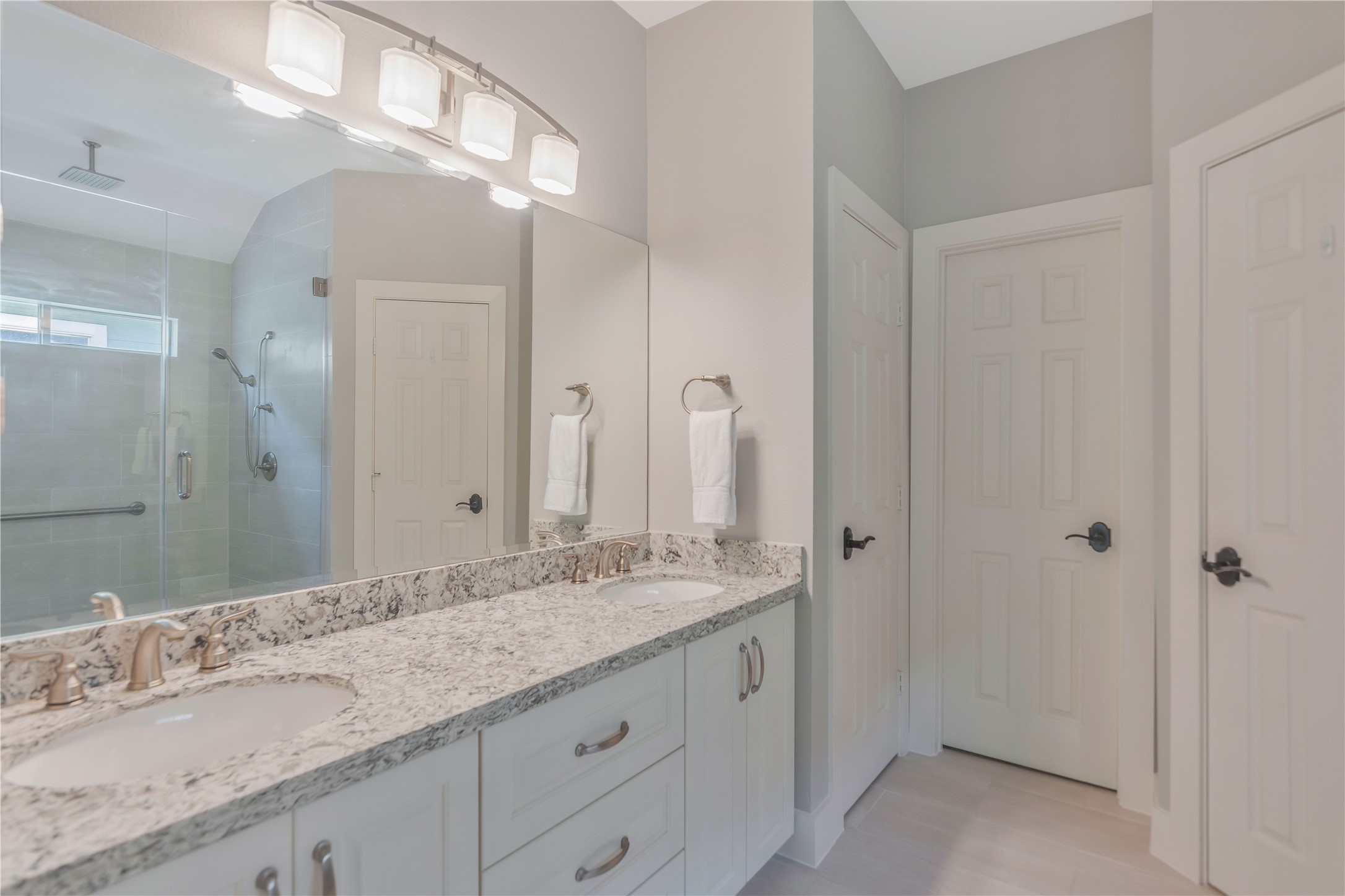 1207 Nagle Street Houston, TX 77003 - Photo 23 of 26 Primary Bathroom had double sink vanity and pull out storage areas under both sinks.