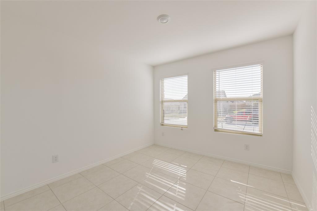 340 Dry Cyn Way Haslet, TX 76052 - Photo 4 of 15 an empty room with windows