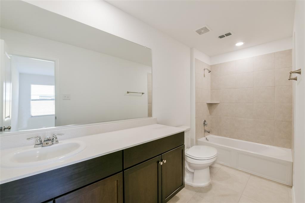 340 Dry Cyn Way Haslet, TX 76052 - Photo 5 of 15 a bathroom with a sink a toilet and shower