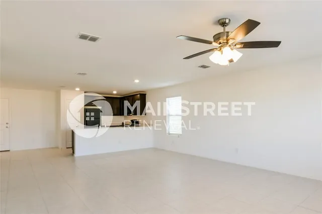 a view of a livingroom and a kitchen