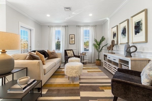 320 Middlesex Avenue, Unit B110 Medford, MA 02155 - Photo 6 of 19 a living room with furniture and wooden floor