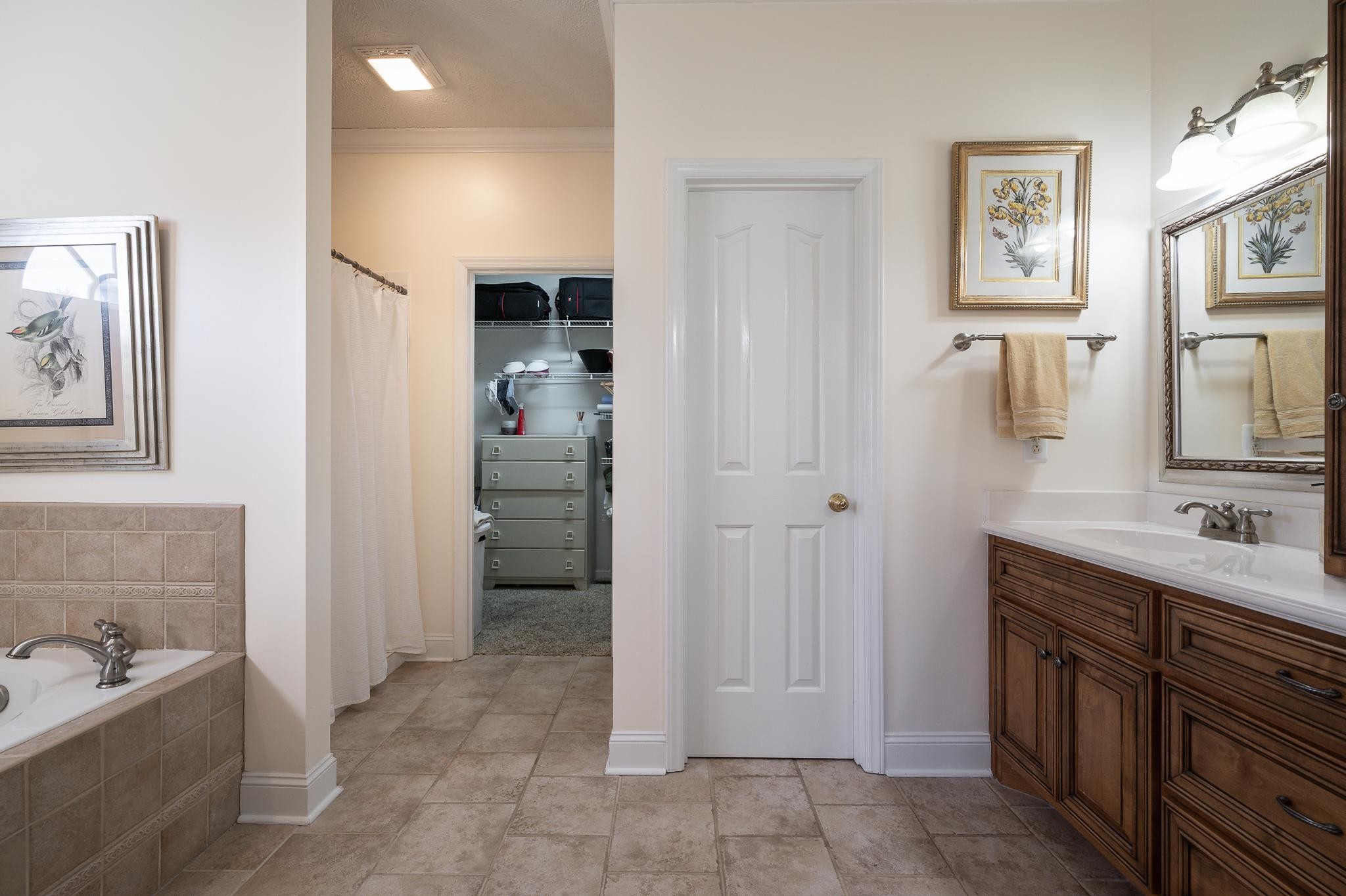 2407 Taylor Close Murfreesboro, TN 37130 - Photo 11 of 42 a bathroom with a tub sink and mirror