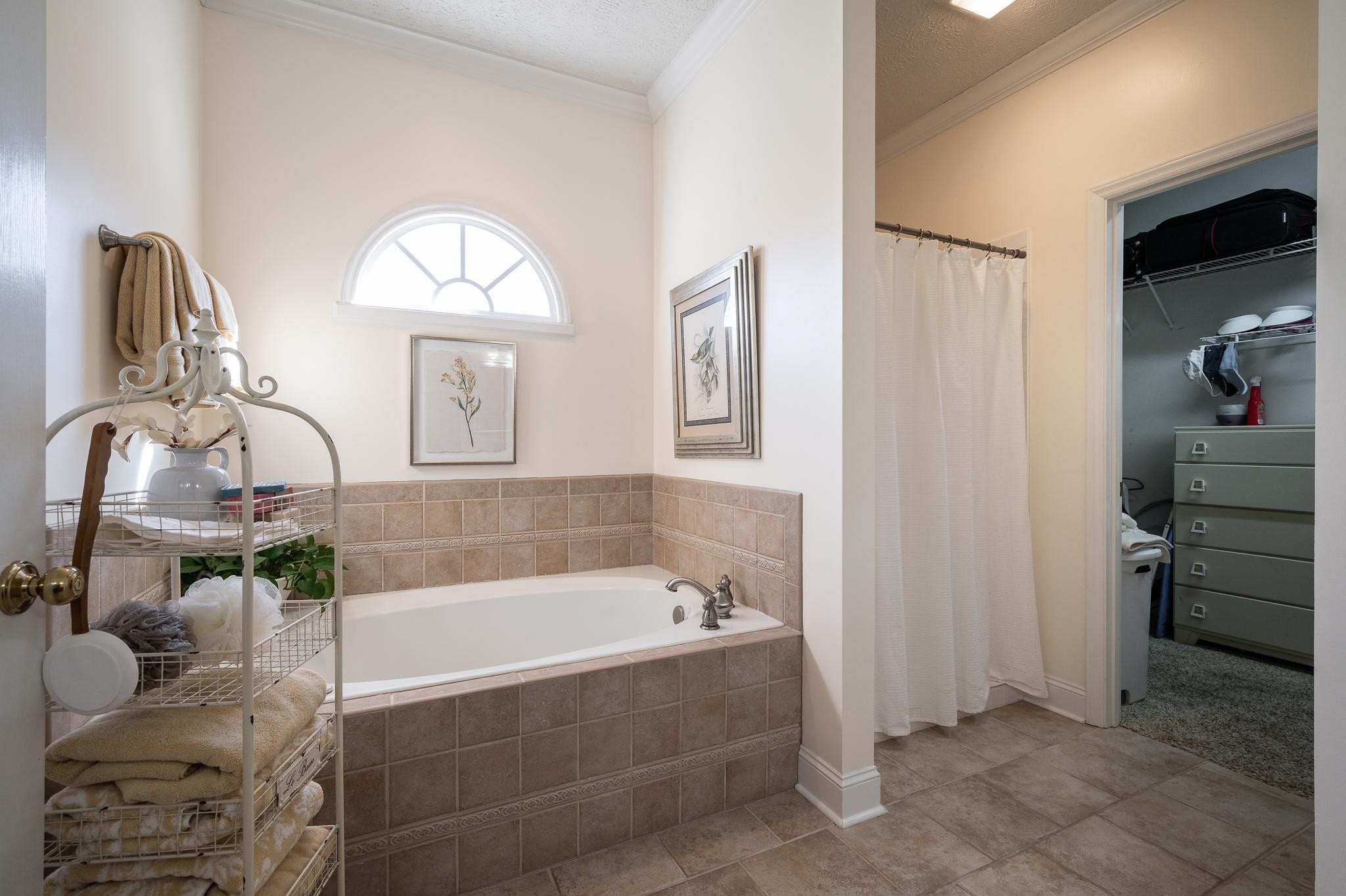 2407 Taylor Close Murfreesboro, TN 37130 - Photo 12 of 42 a bathroom with a tub sink and mirror