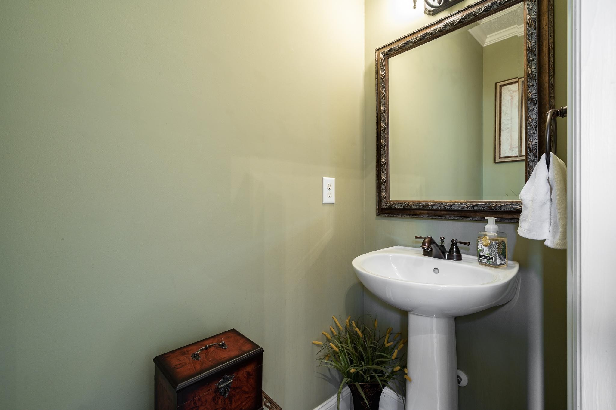 2407 Taylor Close Murfreesboro, TN 37130 - Photo 22 of 42 a bathroom with a sink and a mirror