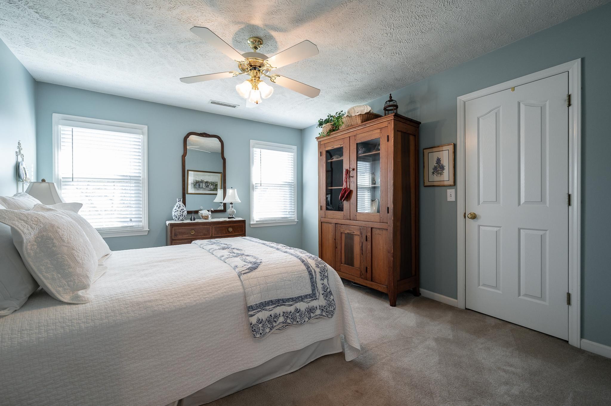 2407 Taylor Close Murfreesboro, TN 37130 - Photo 24 of 42 a spacious bedroom with a bed and a chandelier
