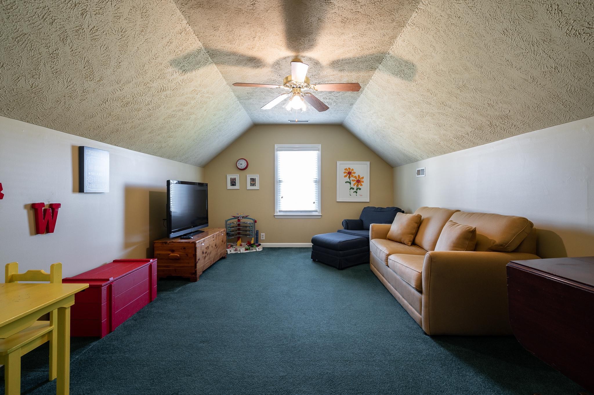 2407 Taylor Close Murfreesboro, TN 37130 - Photo 27 of 42 a living room with furniture chandelier and a flat screen tv