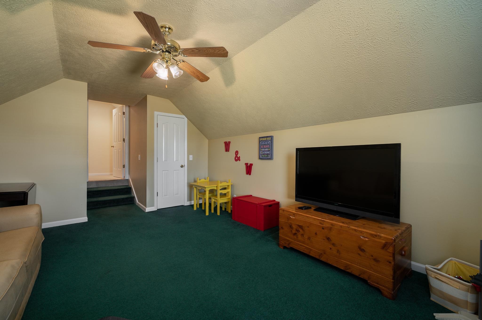 2407 Taylor Close Murfreesboro, TN 37130 - Photo 28 of 42 a living room with furniture and a flat screen tv