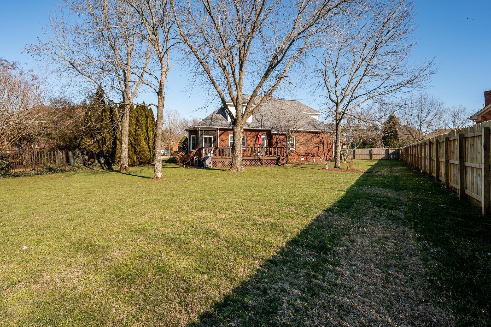 2407 Taylor Close Murfreesboro, TN 37130 - Photo 36 of 42 a view of a yard with yellow house in the background