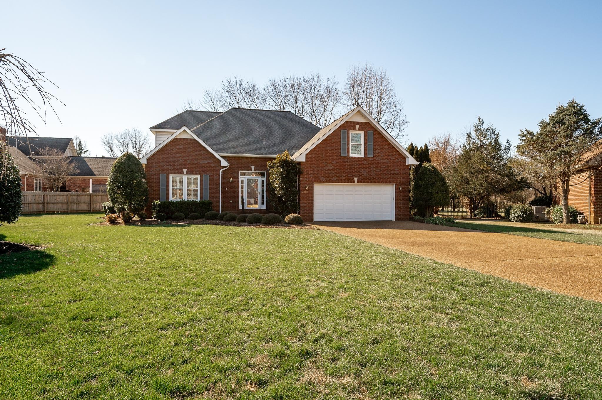 2407 Taylor Close Murfreesboro, TN 37130 - Photo 4 of 42 a front view of a house with a yard and garage