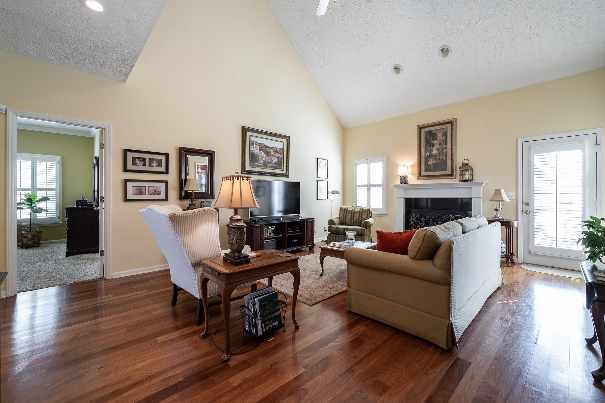 2407 Taylor Close Murfreesboro, TN 37130 - Photo 8 of 42 a living room with fireplace furniture and a wooden floor