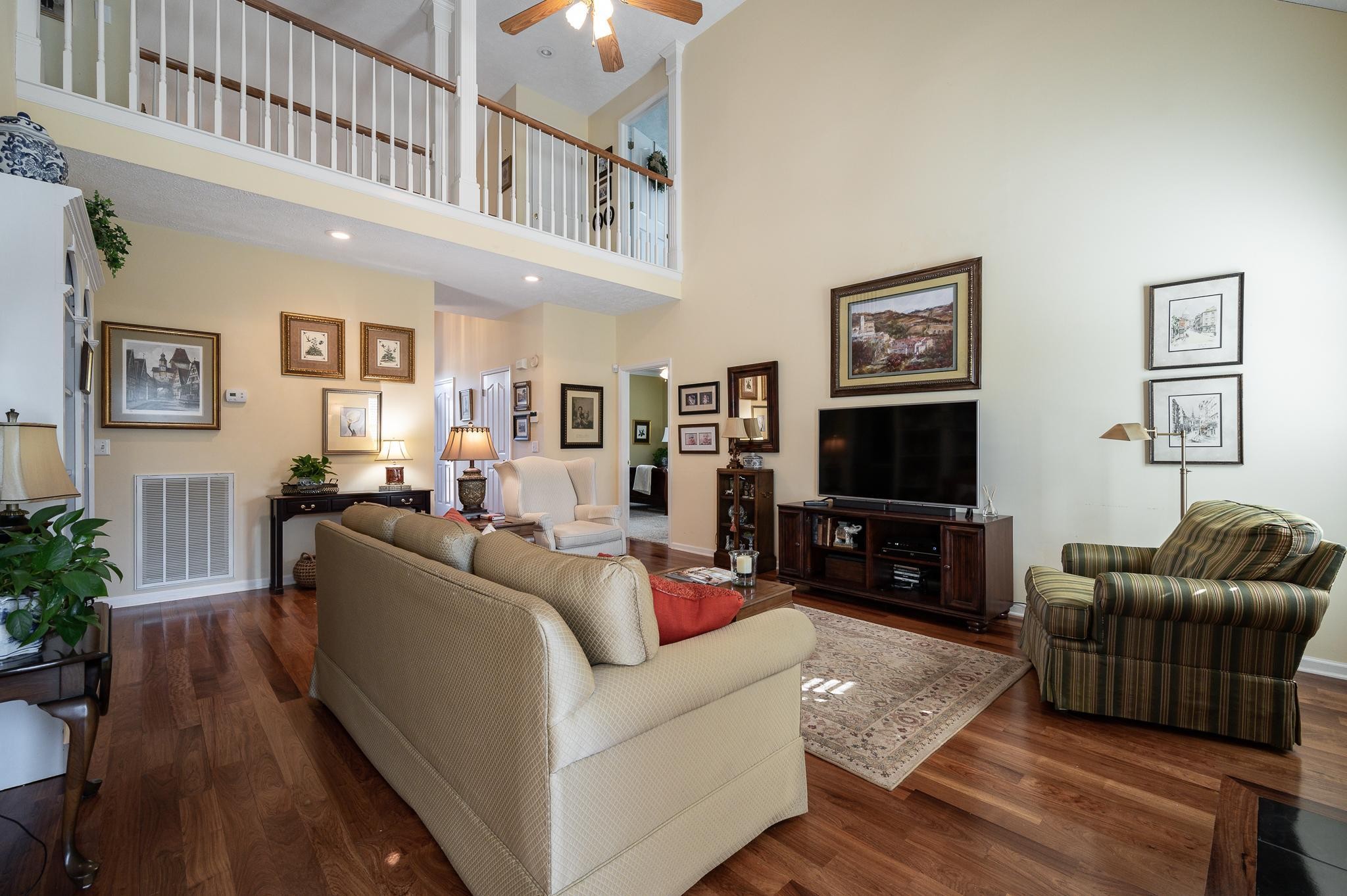 2407 Taylor Close Murfreesboro, TN 37130 - Photo 9 of 42 a living room with furniture and a flat screen tv