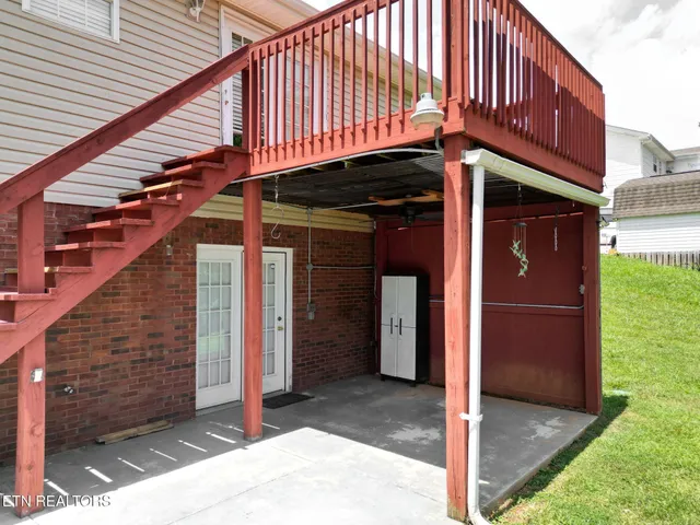 a view of a house with entrance door and stairs