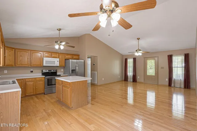 a view of a kitchen with a stove cabinets and wooden floor
