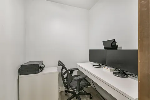 a view of a workspace with furniture