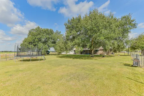 a view of a swimming pool with an outdoor space and seating area