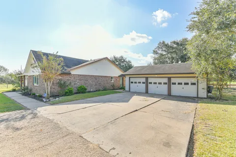 a view of house with yard and entertaining space