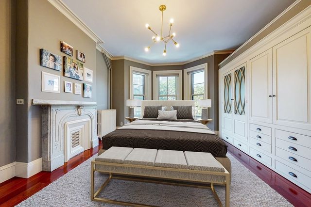 a bedroom with a large bed and a tv