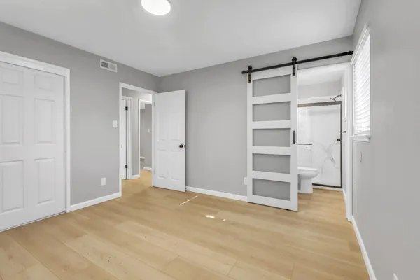 a view of an empty room with a closet