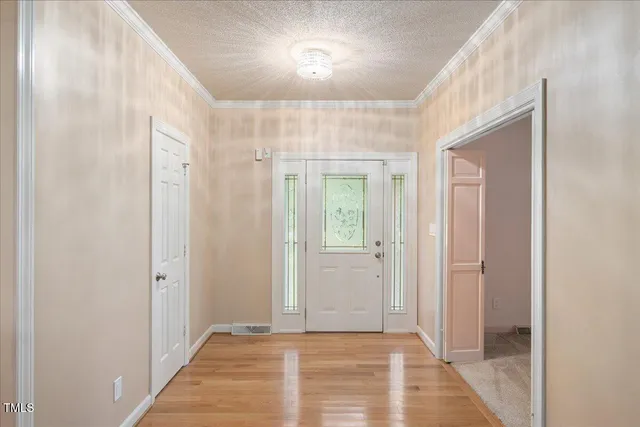 a view of hallway with a mirror and a shower