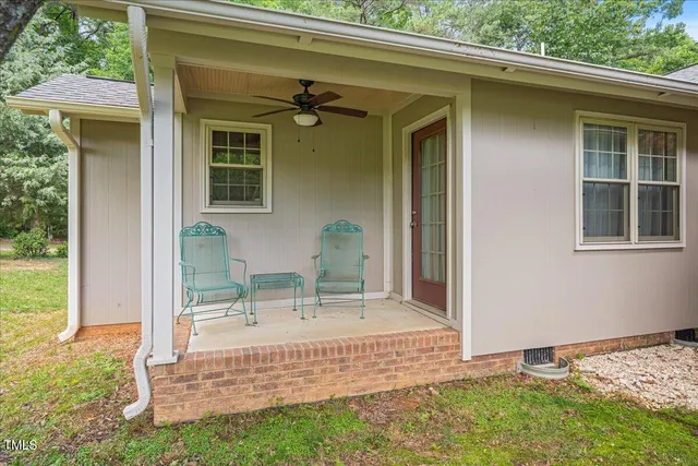 a view of backyard with a porch