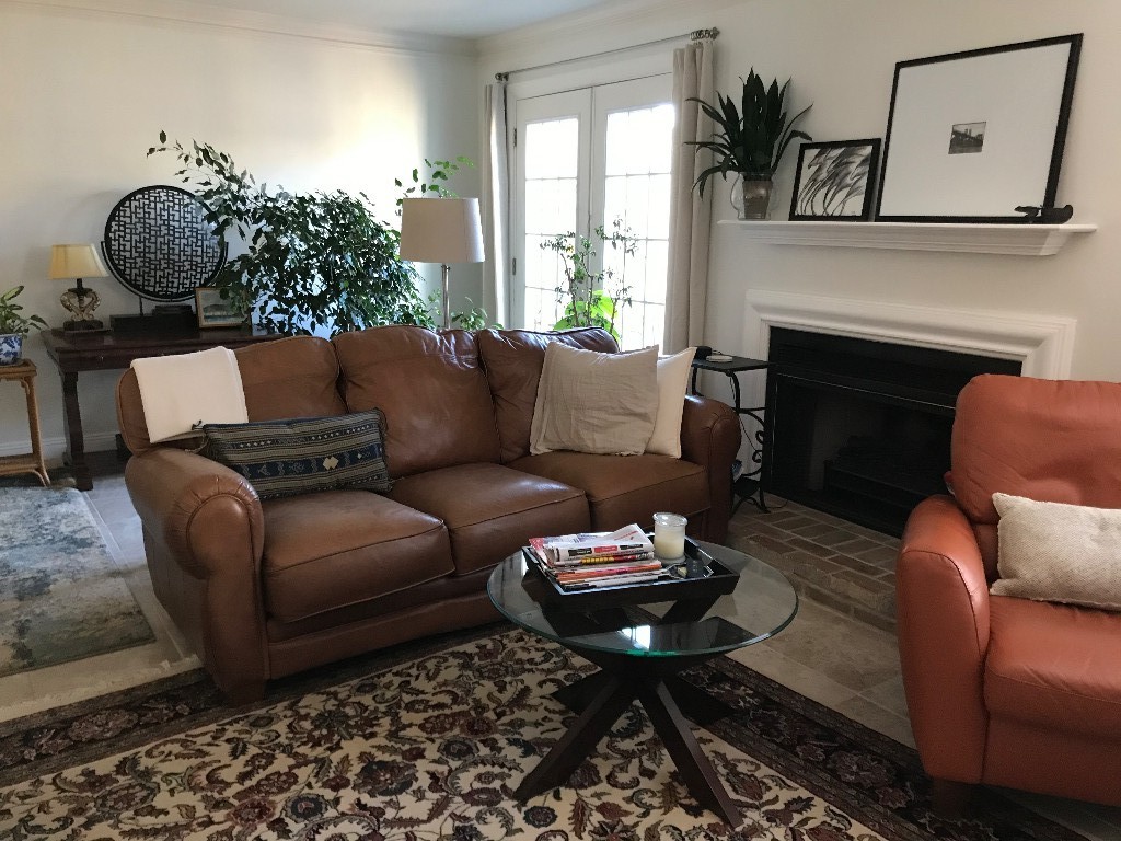 1210 General George Patton Road Nashville, TN 37221 - Photo 16 of 22 a living room with furniture potted plant and a fireplace