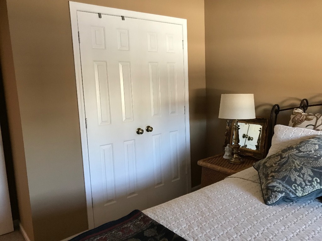 1210 General George Patton Road Nashville, TN 37221 - Photo 3 of 22 a bed room with a bed and a mirror