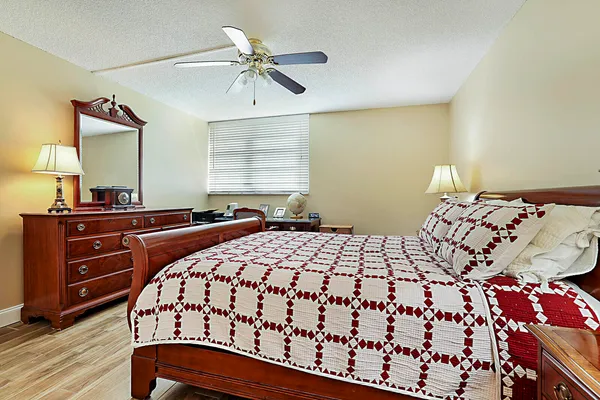 a bedroom with a bed and a dresser