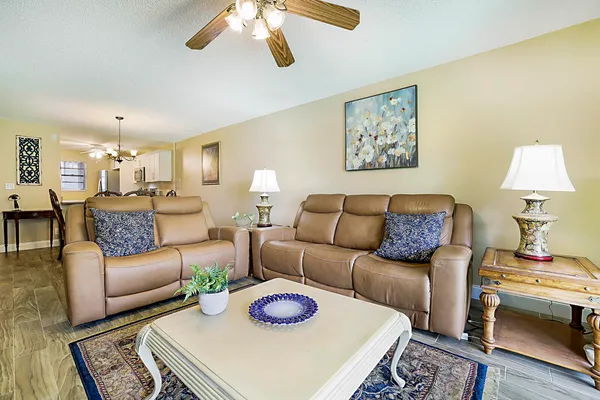 a living room with furniture and a lamp