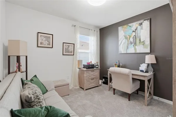 a living room with furniture and a window