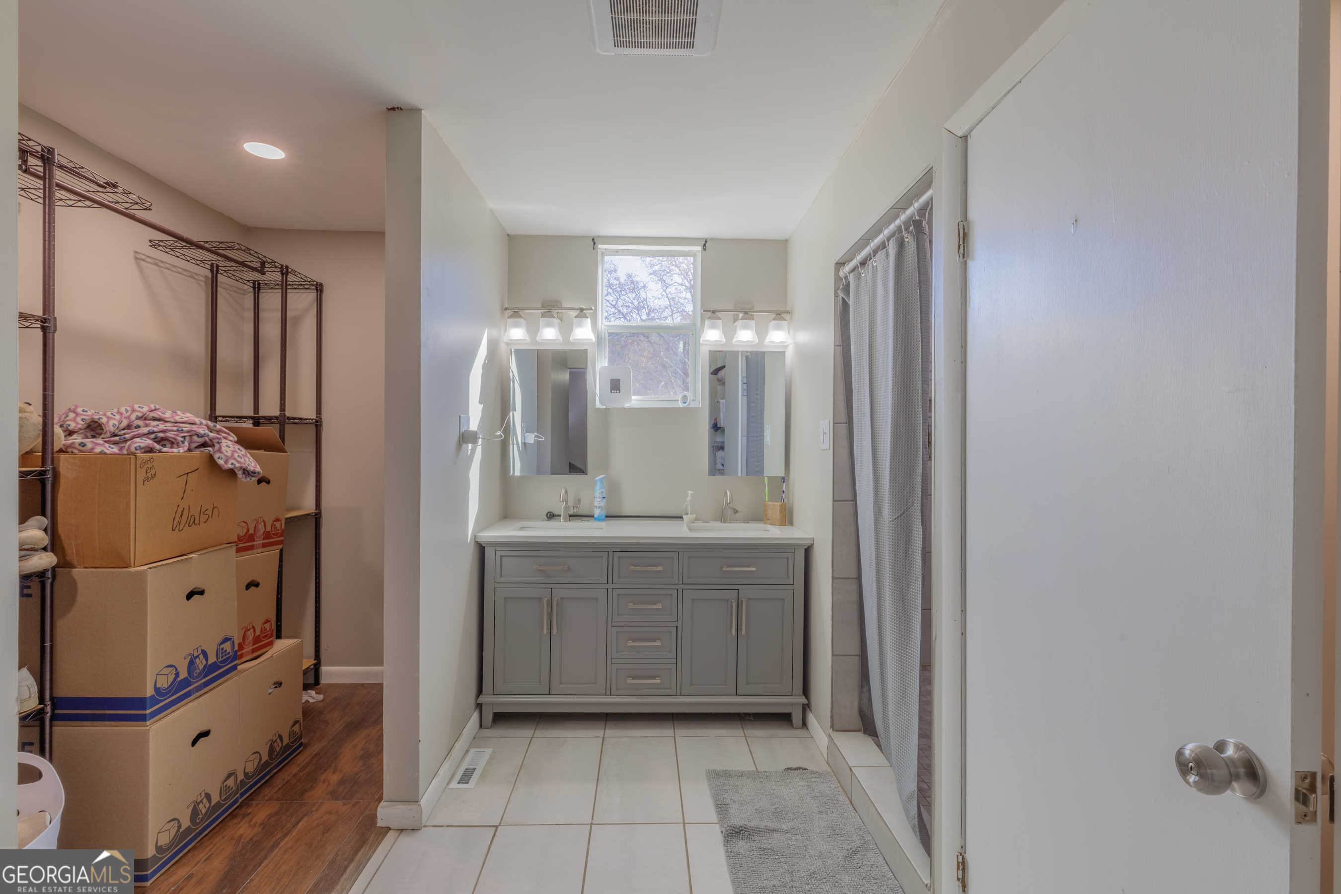 1144 Ridgeway Road LaFayette, GA 30728 - Photo 9 of 66 a bathroom with a mirror a sink and glass door shower